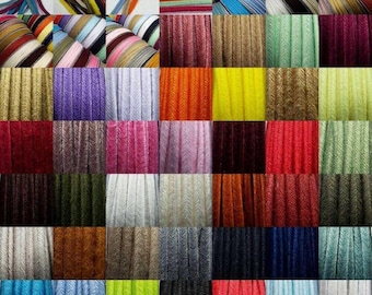 May include: Assortment of 40 colors of 1/4 inch wide,  cord,  elastic,  or ribbon.  The cord is textured and has a herringbone pattern.  The colors include red, blue, green, yellow, orange, purple, pink, brown, black, white, and gray.