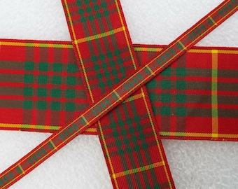 May include: Red, green, and yellow plaid ribbon with a yellow ribbon with the text "Merry Christmas" printed on it.