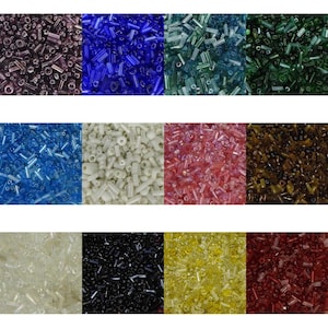 May include: Assortment of glass seed beads in various colours, including purple, blue, green, white, pink, brown, clear, black, yellow, and red. The beads are small and cylindrical in shape.