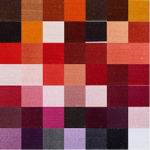 May include: A colour chart with 64 different shades of red, orange, brown, pink, purple, and black. The colours are arranged in a grid pattern.