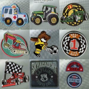 May include: A selection of embroidered iron-on patches. Designs include a blue ambulance, a green tractor, a Formula 1 car, a digger, a bear playing football, and patches with text such as "BEST OF 1" and "SKY ACADEMY CAPTAINS OF THE CLOUDS".