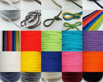 May include: A variety of colors of cotton cord, each wound around a spool. The cords are available in colors such as white, gray, red, green, blue, purple, yellow, orange, and brown.