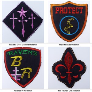 May include: Four embroidered patches with different designs. The first patch is a black diamond with a pink star and three pink crosses. The second patch is a black shield with a red border and the word "PROTECT" in white letters. Inside the shield is a blue circle with a yellow stylized leaf design. The third patch is a black shield with a red border and the words "RAVENS B R" in yellow and green letters. The fourth patch is a black background with a red fleur-de-lis design.