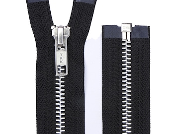 May include: A black zipper with a silver metal slider and teeth. The zipper is open and the slider is in the middle of the zipper. The zipper is labelled "YKK" on the slider.