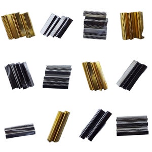 May include: Assortment of metal combs in gold and silver tones. The combs are stacked and arranged in various positions.