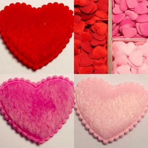 May include: Four felt hearts, two large and two small. The large hearts are red and pink, the small hearts are red and pink. The hearts have scalloped edges.