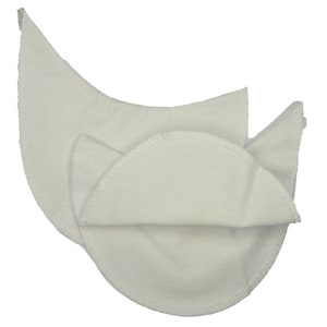 May include: Two white cotton nursing pads with a scalloped edge. The pads are folded in half and are ready to be used.