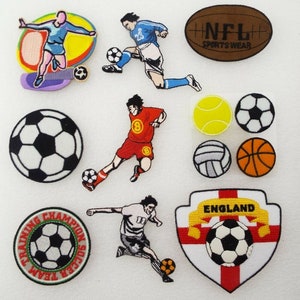 May include: Assortment of embroidered iron-on patches featuring sports themes. Patches include football players, a football, a basketball, a tennis ball, a volleyball, and an American football with the text "NFL Sportswear".