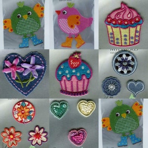 May include: Assortment of iron-on patches featuring various designs, including a green bird, a pink bird, a cupcake, a heart with flowers, a cupcake with a strawberry, a flower, a heart, a flower, a heart, a green bird, and the text "Iron-On Motif".