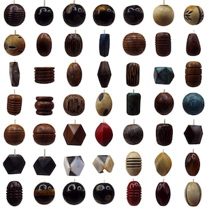 May include: Assortment of wooden beads in various shapes, sizes, and colours. The beads are made from natural wood and have a smooth, polished finish. Some beads have intricate patterns or designs.