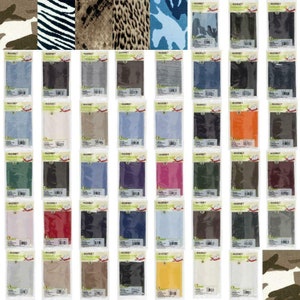 May include: A display of fabric swatches in diverse colours and patterns, such as camouflage, zebra stripes, and animal prints. Each swatch is packaged and labelled with the brand name "MARBET". The swatches are arranged in rows and columns, showcasing a variety of textile options.