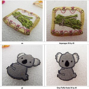 May include: Two embroidered iron-on patches. One is a bunch of green asparagus in a pink and gold frame with the text "Asparagus 50 by 45". The other is a grey koala bear with black eyes and a white nose. The text below the koala is "Grey Fluffy Koala 30 by 40".
