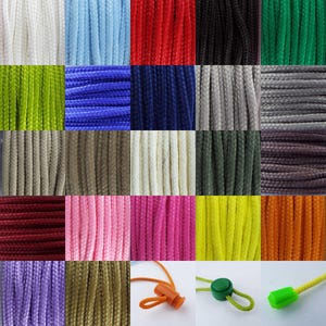 May include: A selection of cords, ropes or strings in a variety of colours. The cords are arranged in a grid pattern. All the cords are the same thickness and texture. The cords are all different colours, including red, blue, green, yellow, orange, purple, brown, white, black and grey.