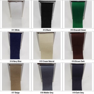 May include: Nine fabric samples in various colours, including white, black, emerald green, navy blue, cream, brown, beige, grey, and dark grey. Each fabric sample is presented in a white frame with a number and colour name printed below.