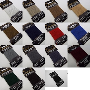 May include: Assortment of 12 spools of thread for mending, each spool is 10 metres long and contains 30% wool and 70% nylon. The spools are arranged in a grid pattern and are labelled with the brand name "LINCATEX" and the text "WOOL/NYLON FOR MENDING".