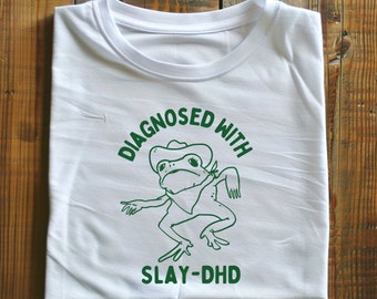 Diagnosed with slay- dhd Unisex Heavy Cotton TeeRism, boneyisland funny Travel Clothing