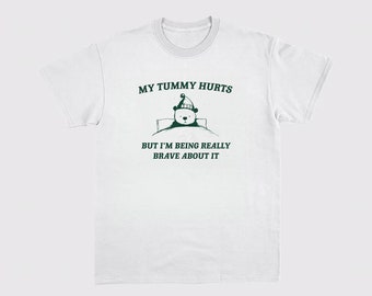 My Tummy hurts But I'm being really brave about it Unisex Heavy Cotton TeeRism, boneyisland funny Travel Clothing