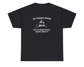 Mijn buik doet pijn, maar ik ben er heel moedig in, unisex zwaar katoenen T-shirt