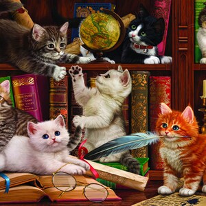 May include: A group of five cats are gathered around a bookshelf filled with books. The cats are all different colors and breeds. One cat is holding a feather quill in its mouth. The cats are surrounded by books, a globe, and a lamp.