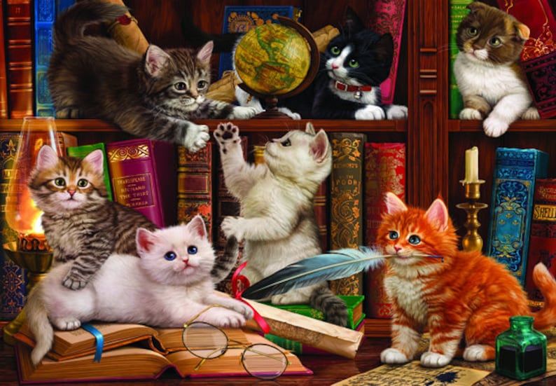 May include: A group of five cats are gathered around a bookshelf filled with books. The cats are all different colors and breeds. One cat is holding a feather quill in its mouth. The cats are surrounded by books, a globe, and a lamp.