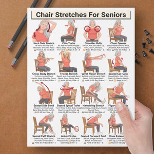 May include: A white instructional poster titled Chair Stretches For Seniors featuring sixteen illustrations of a person in a red shirt and grey trousers performing various seated stretches on a wooden chair with descriptive text and red directional arrows.