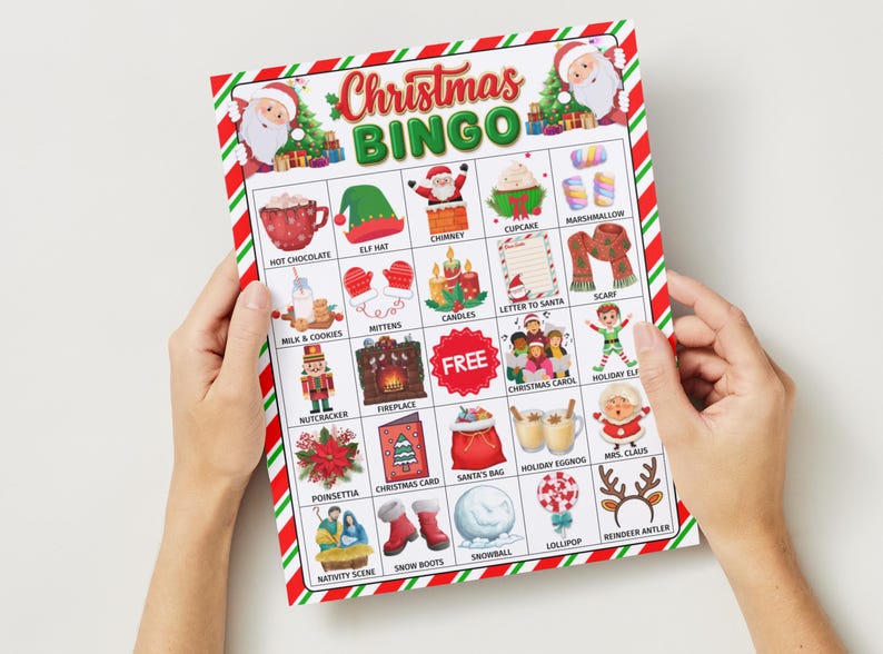 May include: A Christmas Bingo game card with a red and green striped border. The card features festive illustrations like Santa Claus, hot chocolate, and a Christmas tree. The words "Christmas Bingo" are at the top.