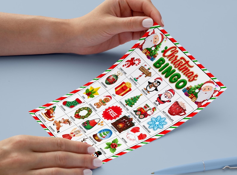 May include: Christmas Bingo game card with festive illustrations, including Santa Claus, ornaments, and a Christmas tree. The card has a red and green striped border and the words "Christmas Bingo" in a decorative font.