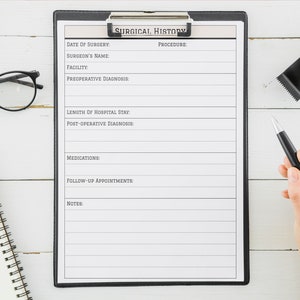 May include: A black clipboard with a white sheet of paper titled "Surgical History". The paper has lines for recording information such as date of surgery, surgeon's name, facility, pre-operative diagnosis, procedure, length of hospital stay, post-operative diagnosis, medications, follow-up appointments, and notes.