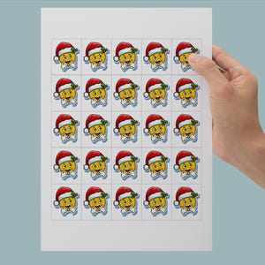 May include: Sheet of stickers featuring a cartoon emoji wearing a Santa hat and a white beard. The emoji has a yellow face, a red and white hat, and a white beard. The stickers are arranged in a grid pattern.