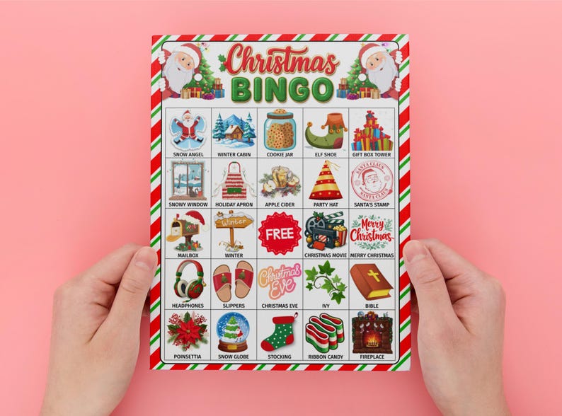 May include: A Christmas Bingo game card with a red and green border, held by hands against a pink background. The card features festive illustrations and the text "Christmas BINGO". Images include Santa, a snowman, and a Christmas tree.
