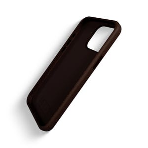 May include: A brown leather phone case with a raised textured surface. The case has a cutout for the camera lens and a small logo on the back.