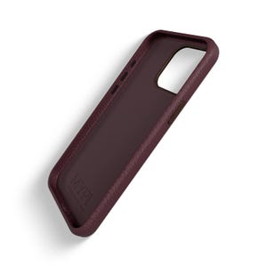 May include: A burgundy leather phone case with the word "M2P1" printed on the back.