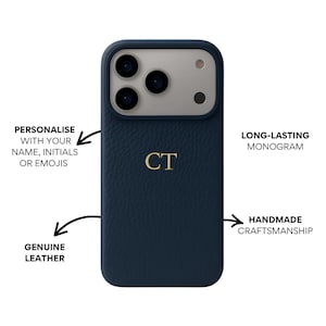 May include: A navy blue leather phone case with a gold monogram of the initials "CT". The case features a textured surface and a camera cutout. Text on the image reads "Personalise with your name, initials or emojis", "Long-lasting monogram", "Genuine leather", and "Handmade craftsmanship".