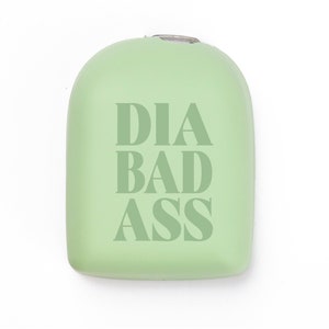 May include: A light green, rounded, plastic container with the text "DIA BAD ASS" printed in white.