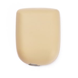May include: A beige, oval-shaped, plastic soap dispenser with a silver pump.