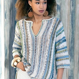 May include: A crocheted top with a striped pattern in shades of blue, green, and white. The top has a v-neck and three-quarter sleeves.