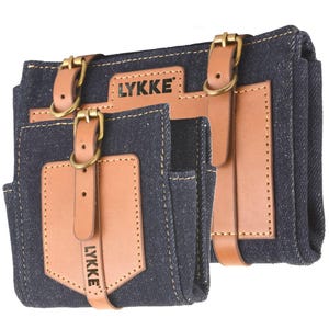 May include: A blue denim tool belt with brown leather straps and pockets. The belt has the word "LYKKE" printed on it.