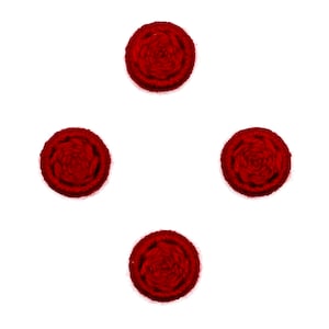 May include: Four red fabric covered buttons with a raised center design.