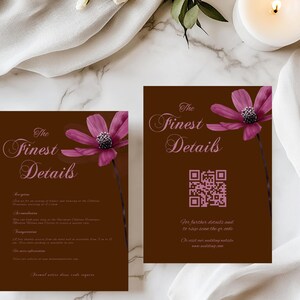 May include: Two brown wedding invitation cards with the text "The Finest Details" in elegant script. Each card features a pink flower and a QR code. The cards are on a marble surface with a lit candle and white fabric.