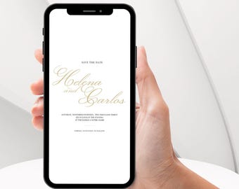 May include: A white smartphone screen displays a save the date announcement for a wedding. The announcement features the names "Helena and Carlos" in gold script font. The date and location of the wedding are listed below the names.