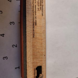 May include: A wooden stamp with a black boot silhouette and the text "7gypsies collections from the journey." The stamp has a black and red rubber base. The stamp is marked "Distributed by: Hampton Art, Made in China."