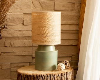 Round green-rust matte stoneware ceramic bedside table lamp with Raffia/Rattan shade