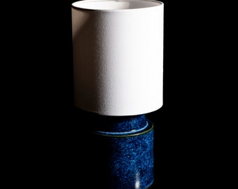 Round blue - greenish-white  effect handpainted stoneware ceramic bedside table lamp with white or raffia fabric shade