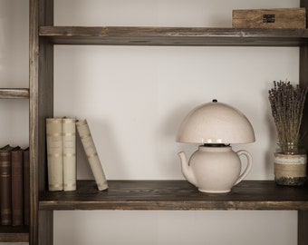 Extravagant ceramic lamp in japanese teapot shape with glazed spotted white ceramic lampshade.