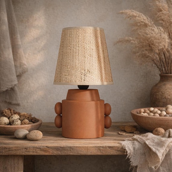 Natural red clay table lamp with conical rattan shade