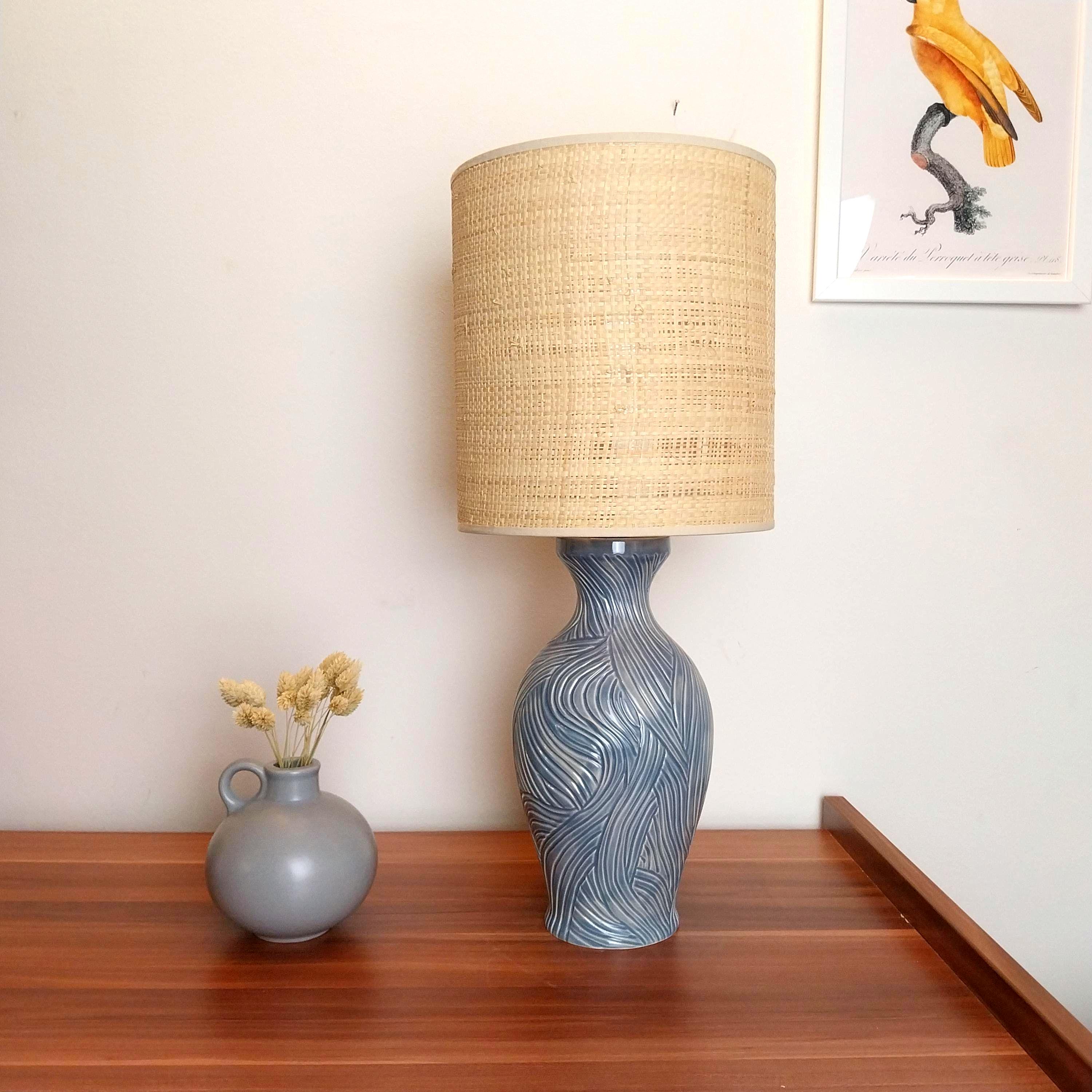 Blue handcarved ceramic table lamp with Raffia/rattan fabric shade