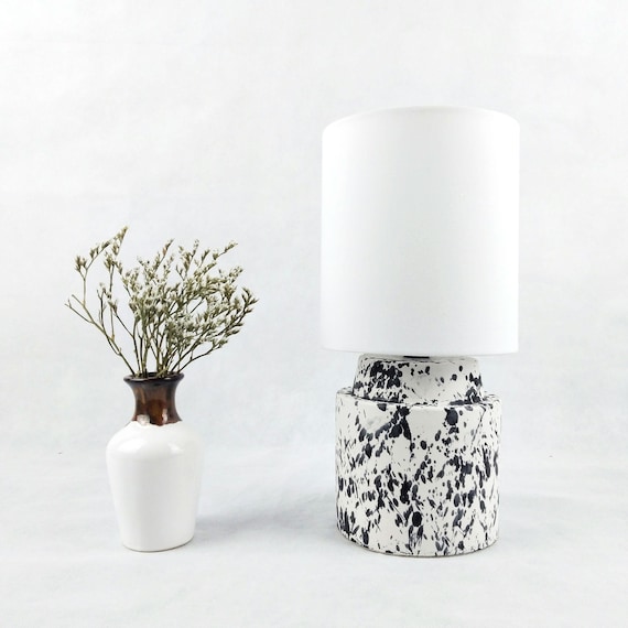 Round ,modern, white and black ceramic table lamp with white  fabric shade