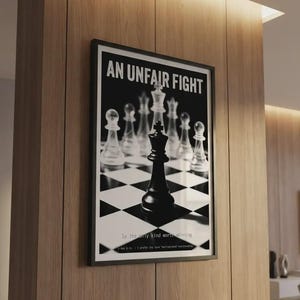 May include: Framed black and white art print featuring a chess game. The image shows a black king piece on a checkered board, with the text "AN UNFAIR FIGHT" at the top. The bottom text reads "Is the only kind worth winning."