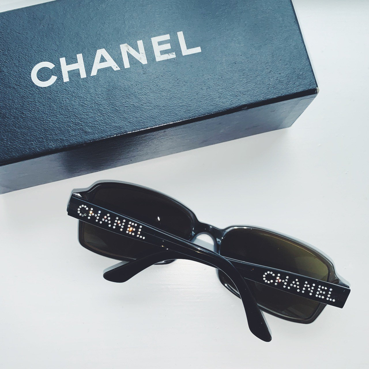 Vintage Chanel dark green rectangular sunglasses with tinted lenses and  Swarovski crystal spell out logo on arms