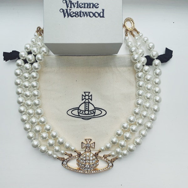 Vivienne Westwood gold triple row pearl choker necklace with large Swarovski Crystal encrusted orb pendant